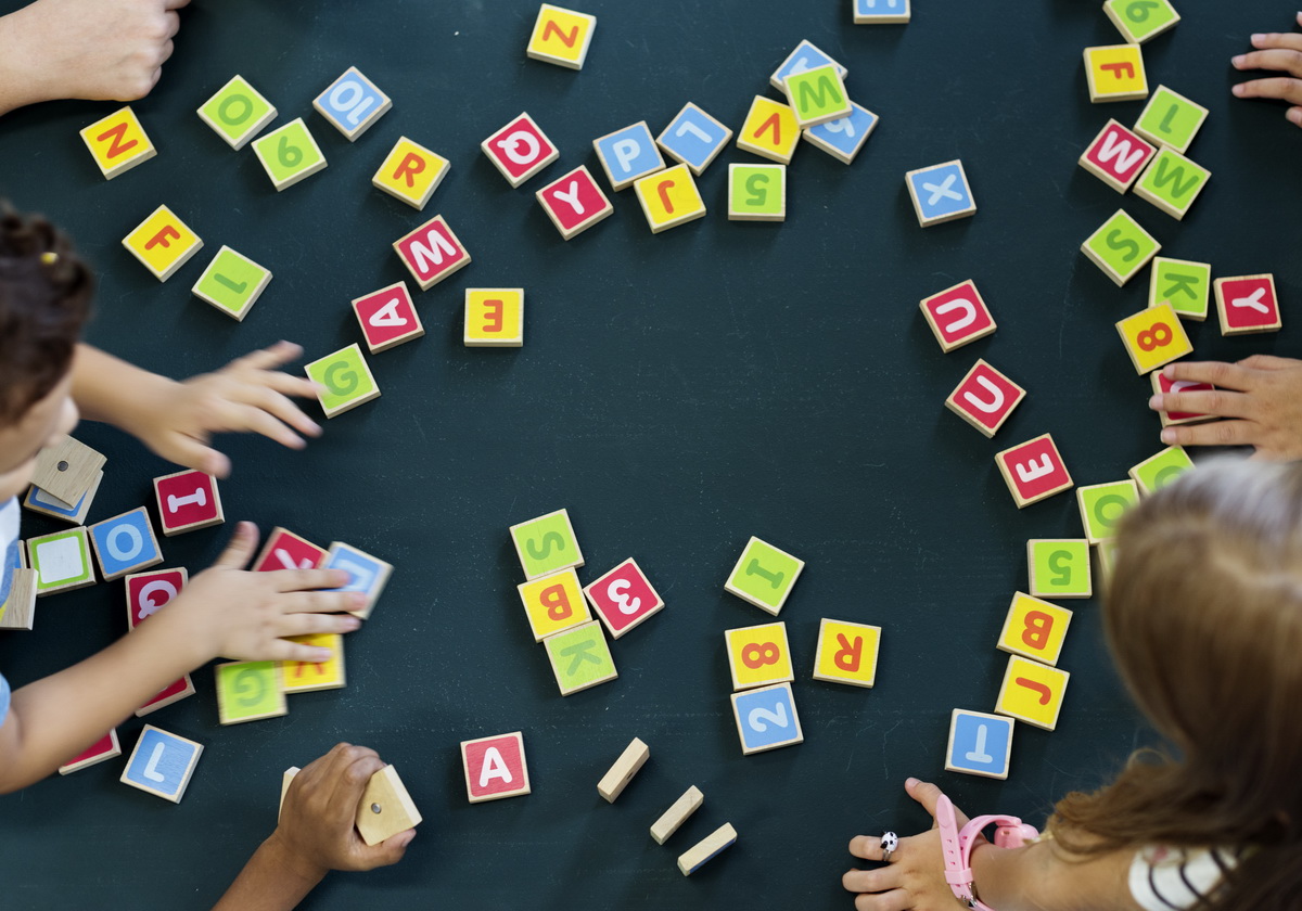 kindergarten kids playing wooden alphabets letters 2023 11 27 05 12 40 utc